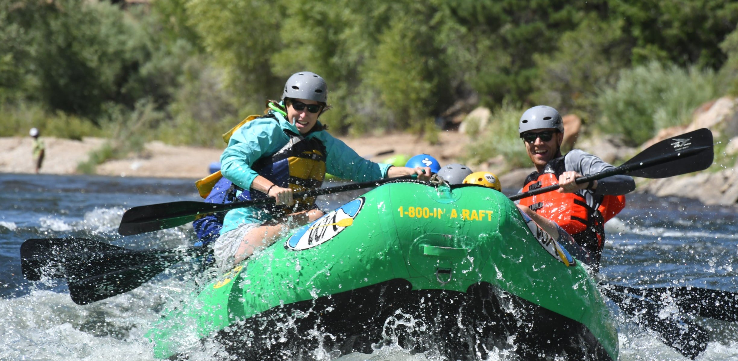 Rafting group paddles into rapids on a Browns Canyon river rafting trip.