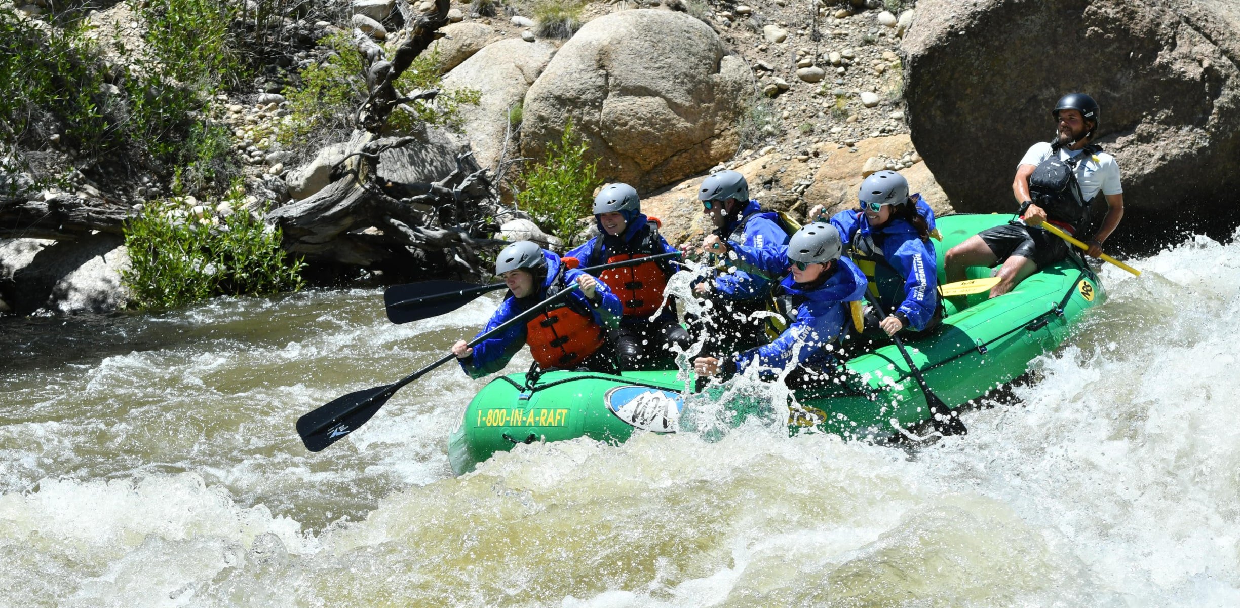 Rafting group paddling in rapids on a Browns Canyon river rafting trip.