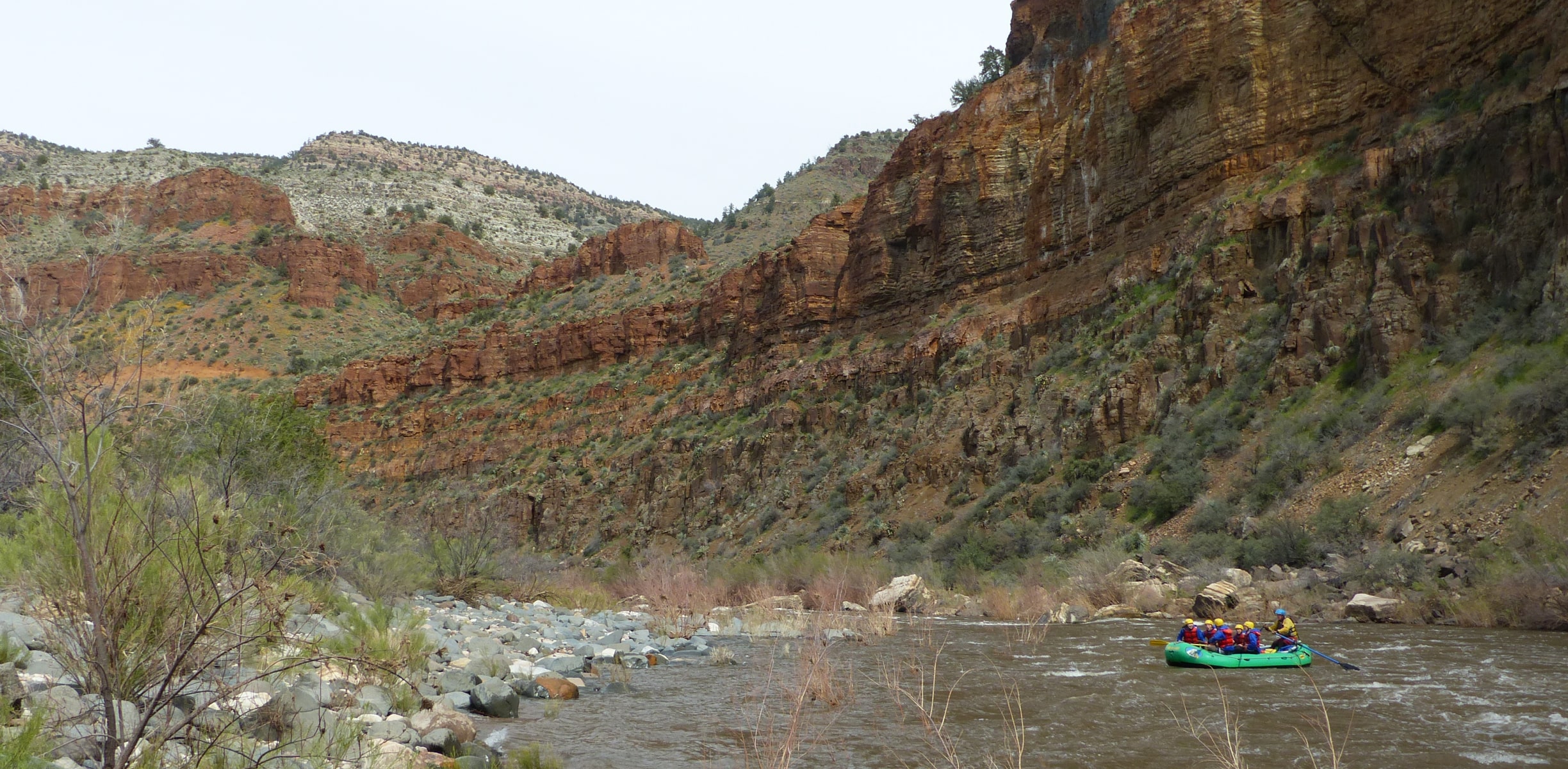 A group of white water rafters hitting a set of rapids in Arizona