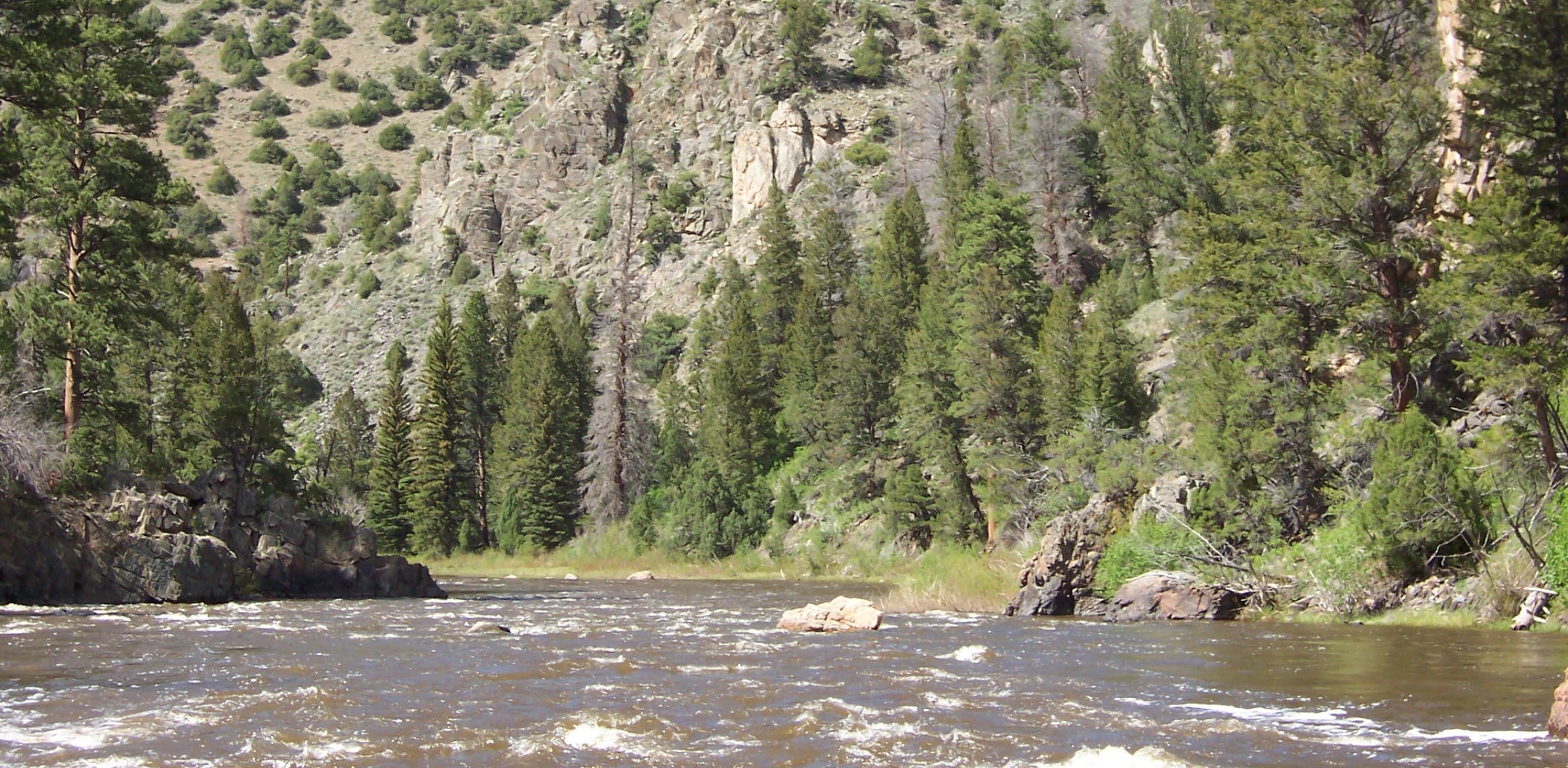 A river running through rocky mountains