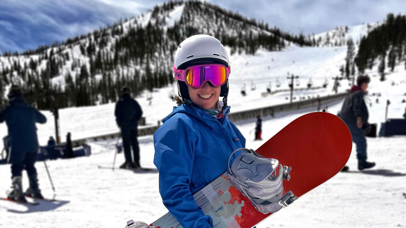 A woman holds a snowboard at the Monarch mountain ski area in buena vista